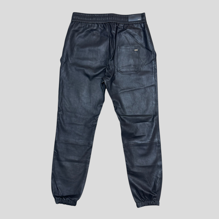 CLB XXIII Amiri black genuine leather drawstring pants with elastic cuffs and back pocket, back view