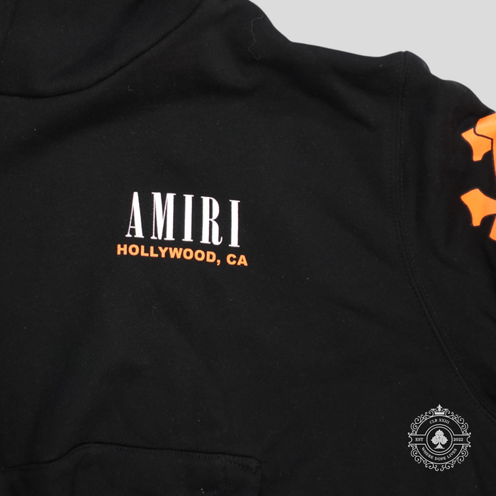 CLB XXIII Amiri black cotton hoodie with orange bones graphic and Hollywood CA logo print