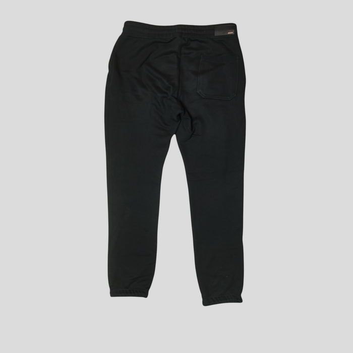 Back view of CLB XXIII Amiri black cotton sweatpants with a single rear pocket and branded tag