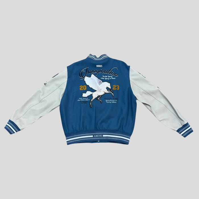 CLB XXIII Amiri oversized varsity jacket in blue and white with Pegasus embroidery and varsity-style lettering