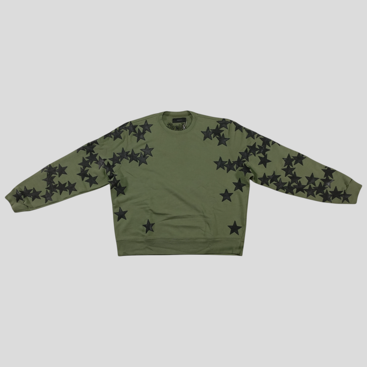 CLB XXIII Amiri green cotton crewneck sweatshirt featuring black star applique detailing on the front and sleeves.