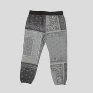 CLB XXIII Amiri grey cotton sweatpants featuring a patchwork bandana print design with a black elastic waistband.