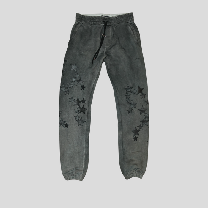 CLB XXIII Amiri grey cotton sweatpants featuring black leather star patches and a drawstring waist.