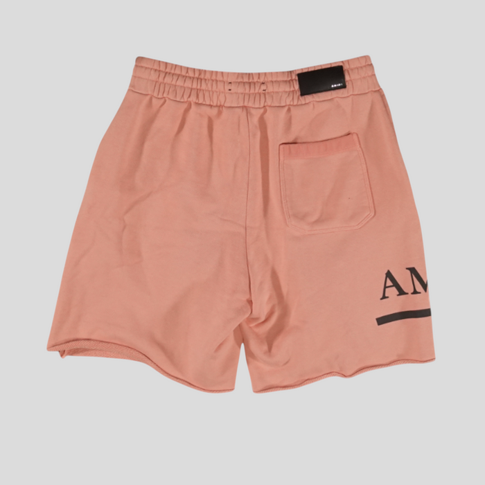 CLB XXIII Amiri MA Bar sweatshorts in peach pink cotton with a back pocket and black logo detail.