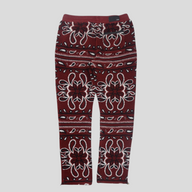 CLB XXIII Amiri red fleece pants featuring a white and black bandana paisley pattern with an elastic waistband