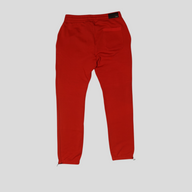 CLB XXIII Amiri red cotton sweatpants with back pocket and drawstring cuffs, shown from the back.