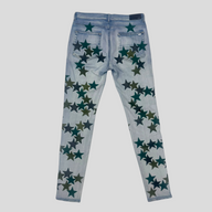 CLB XXIII Amiri light indigo denim jeans featuring green star patches on the back view