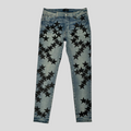 CLB XXIII Amiri Chemist star patch jeans in clay indigo denim with black star appliqués and distressed detailing.