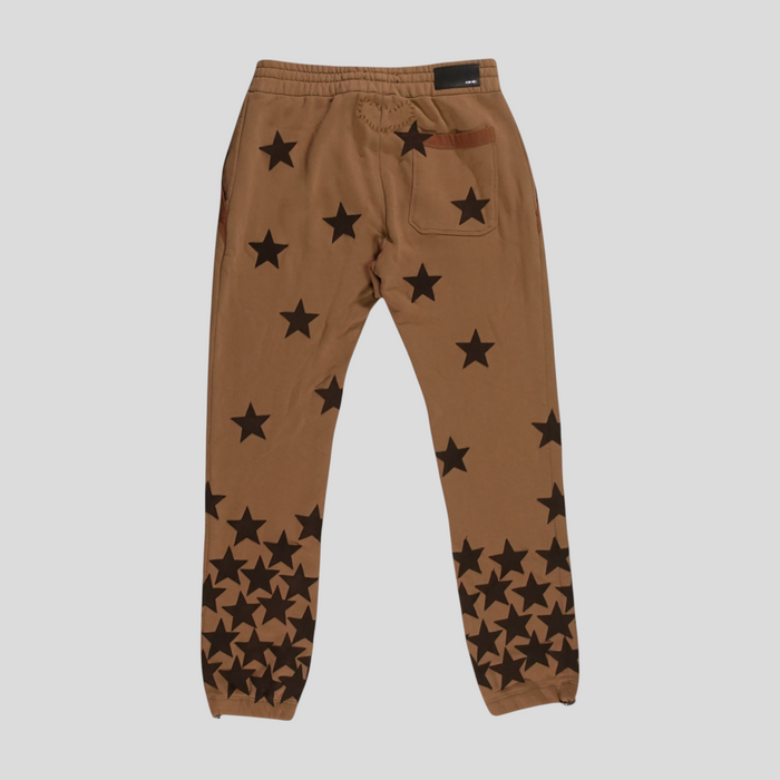 CLB XXIII Amiri Chemist tobacco brown cotton sweatpants with black star pattern and back pocket detail