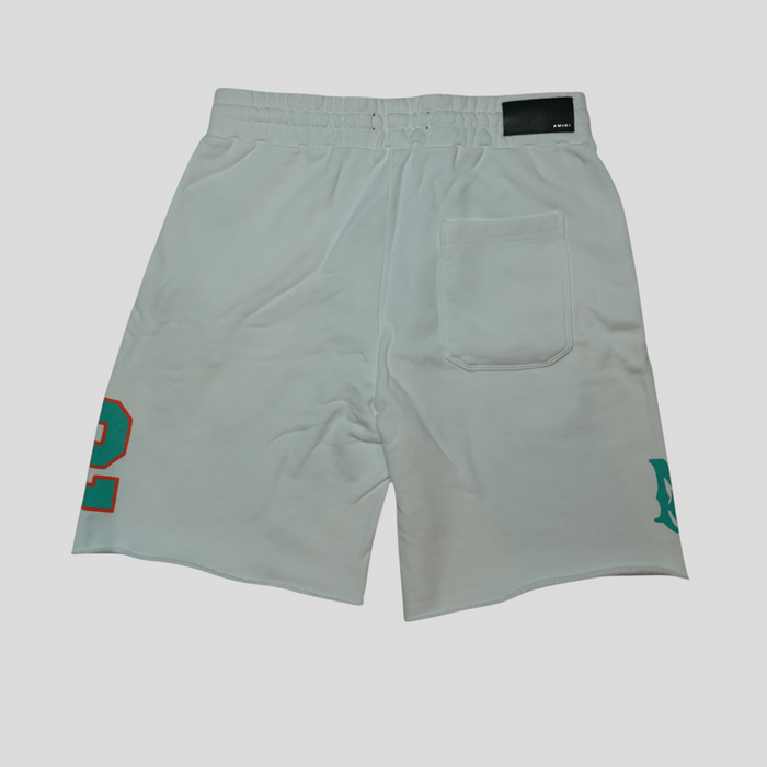CLB XXIII Amiri white cotton oversized football shorts with orange and green graphic details and back pocket