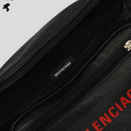 CLB XXIII Balenciaga black leather waist bag featuring a red logo and interior brand label detail