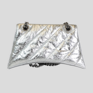 CLB XXIII Balenciaga Crush small chain bag in metallic silver crinkled leather with a curved base and chain strap.