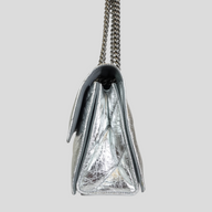CLB XXIII Balenciaga Crush small chain bag in metallic silver crinkled leather, side profile view.