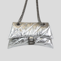 CLB XXIII Balenciaga Crush small chain bag in metallic silver crinkled leather with a signature B logo hardware
