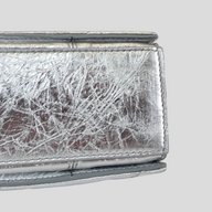 CLB XXIII Balenciaga Crush small chain bag in metallic silver crinkled leather, close-up view of textured finish.