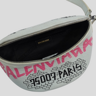 CLB XXIII white leather Balenciaga XS Souvenir belt bag with pink and black graffiti print and zip closure