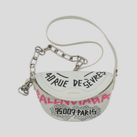 CLB XXIII white leather Balenciaga XS Souvenir belt bag with black and pink graffiti print and silver chain strap.