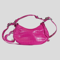 CLB XXIII Balenciaga Le Cagole XS shoulder bag in hot pink crocodile-embossed leather with heart-shaped mirror charm.