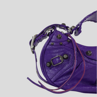 CLB XXIII Balenciaga Le Cagole XS shoulder bag in purple leather with silver-tone metal studs and buckle detail
