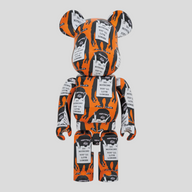CLB XXIII 1000% Bearbrick Banksy Monkey Sign figure in orange, white, and black with iconic monkey graphic print.
