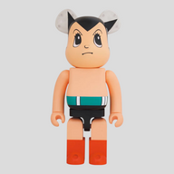 CLB XXIII 1000% Bearbrick Astro Boy Brave collectible figure in tan with iconic black hair and red boots