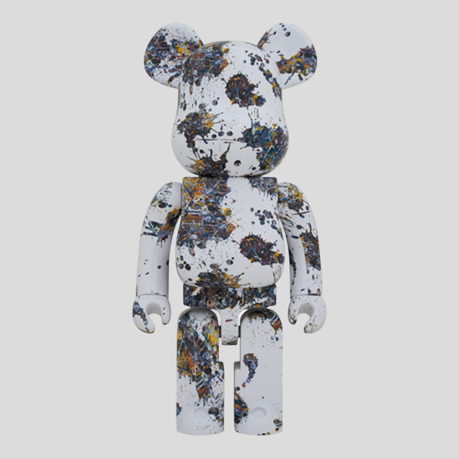CLB XXIII 1000% Bearbrick Jackson Pollock Studio Splash figure with white base and multi-colored paint splatters