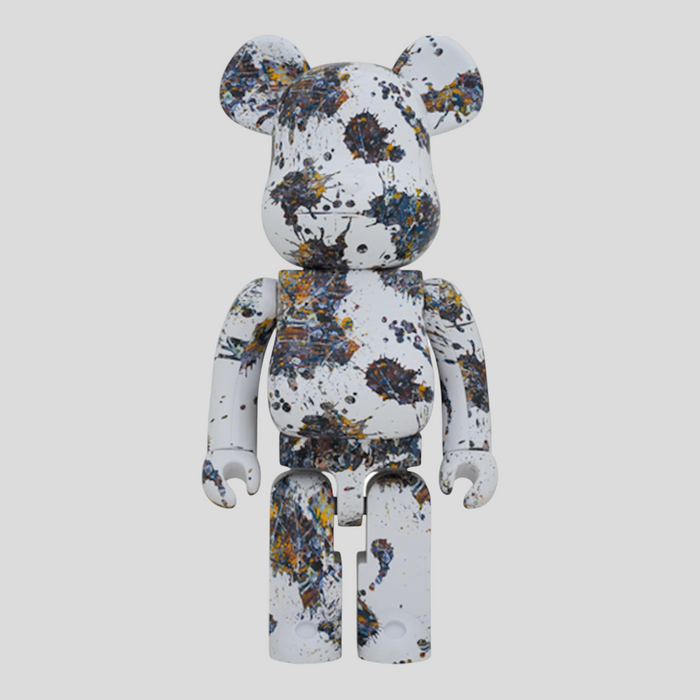CLB XXIII 1000% Bearbrick Jackson Pollock Studio Splash figure with white base and multi-colored paint splatters