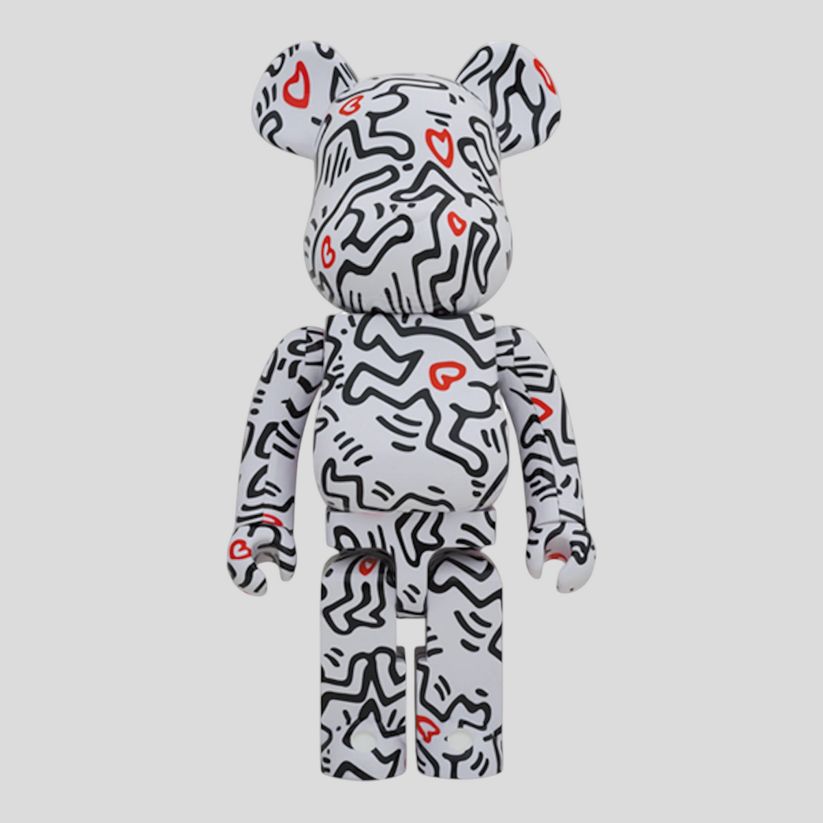 CLB XXIII 1000% Bearbrick Keith Haring #8 collectible figure in white with black line art and red heart accents.