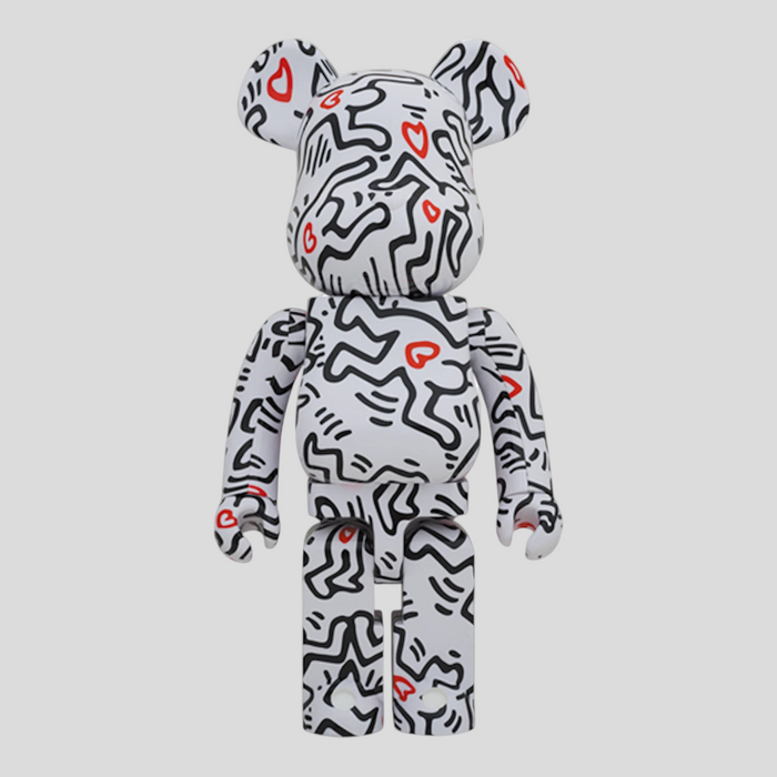CLB XXIII 1000% Bearbrick Keith Haring #8 collectible figure in white with black line art and red heart accents.