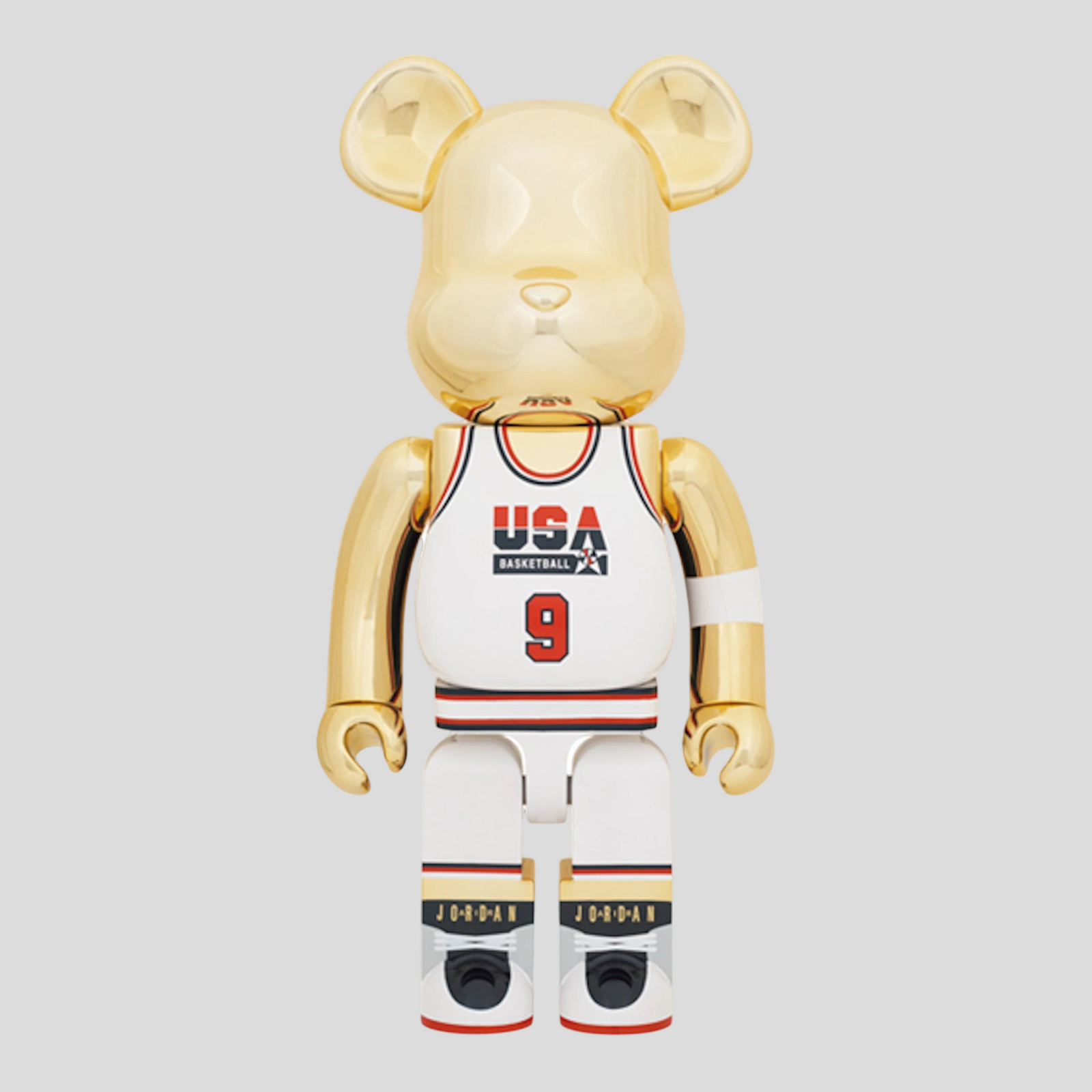 CLB XXIII 1000% Bearbrick Michael Jordan 1992 Team USA figure in gold, white, red, and navy with basketball jersey