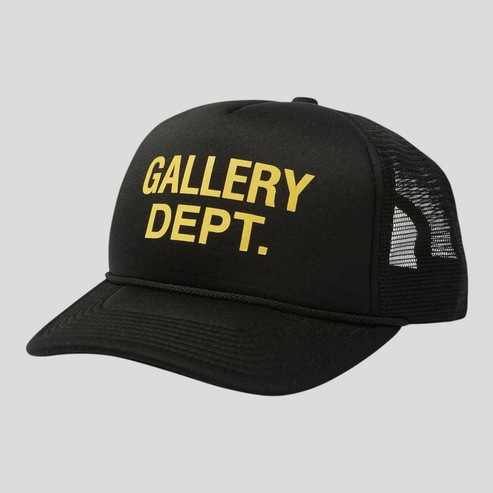 CLB XXIII black trucker hat with yellow GALLERY DEPT. text, featuring a mesh back and structured front panel.