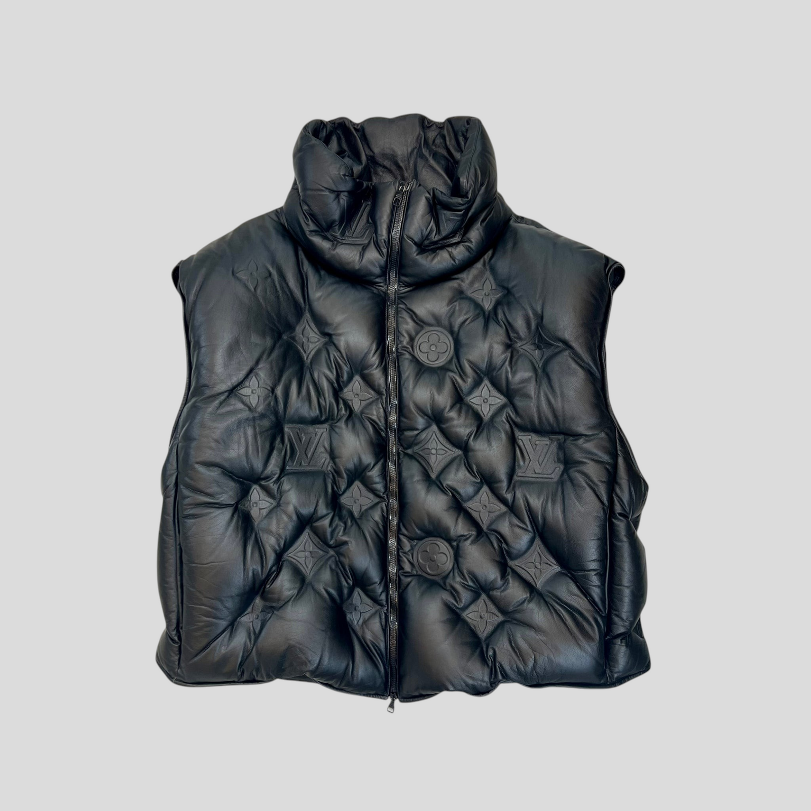 CLB XXIII black calfskin leather puffer vest featuring embossed Louis Vuitton monogram patterns and a zip-up front.