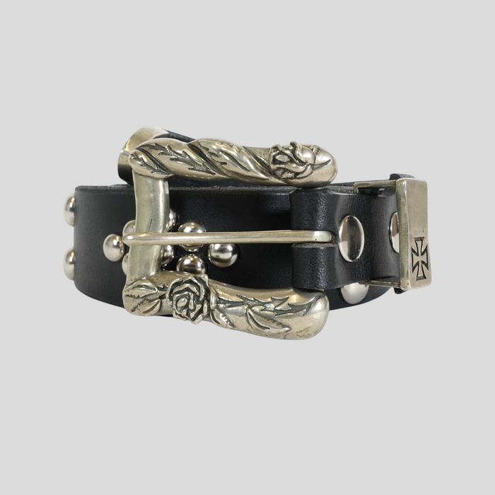CLB XXIII Enfants Riches Déprimés black leather belt with silver rose-engraved buckle and metal stud detailing.