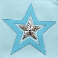 CLB XXIII light blue leather tote bag featuring a stitched star patch with a polished silver star emblem center