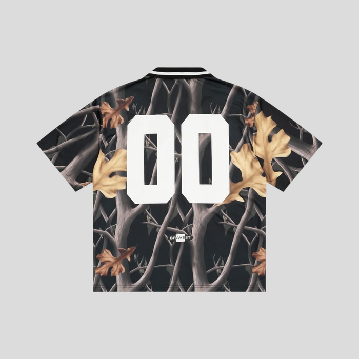 CLB XXIII Bravest Studios Greenwich soccer jersey featuring a black and brown forest camouflage print with white 00