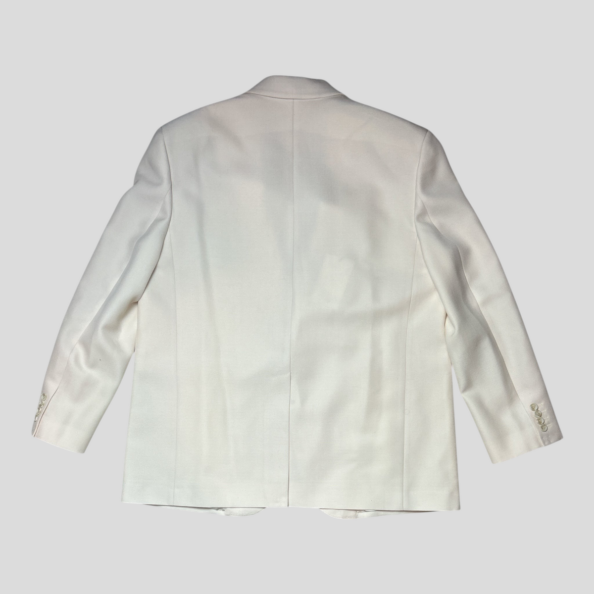 Back view of a cream Celine mohair and wool suit jacket from CLB XXIII featuring a single vent and button cuffs.