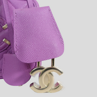 CLB XXIII Chanel purple caviar leather vanity case featuring a gold CC lock and key detail