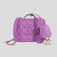 CLB XXIII Chanel Caviar quilted purple vanity case with CC logo, gold hardware, and matching lock and key charm.
