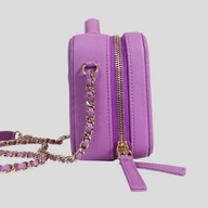 CLB XXIII Chanel purple caviar quilted vanity case with gold chain strap and CC lock, side view