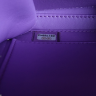 CLB XXIII Chanel Caviar Quilted Vanity Case interior showing the purple leather lining and serial number sticker