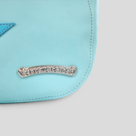 CLB XXIII Chrome Hearts blue leather Nip & Tuck bag featuring a signature silver logo plaque and star patch detail.