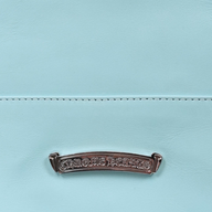 CLB XXIII Chrome Hearts light blue leather tote bag featuring a detailed silver logo plaque with intricate engraving.