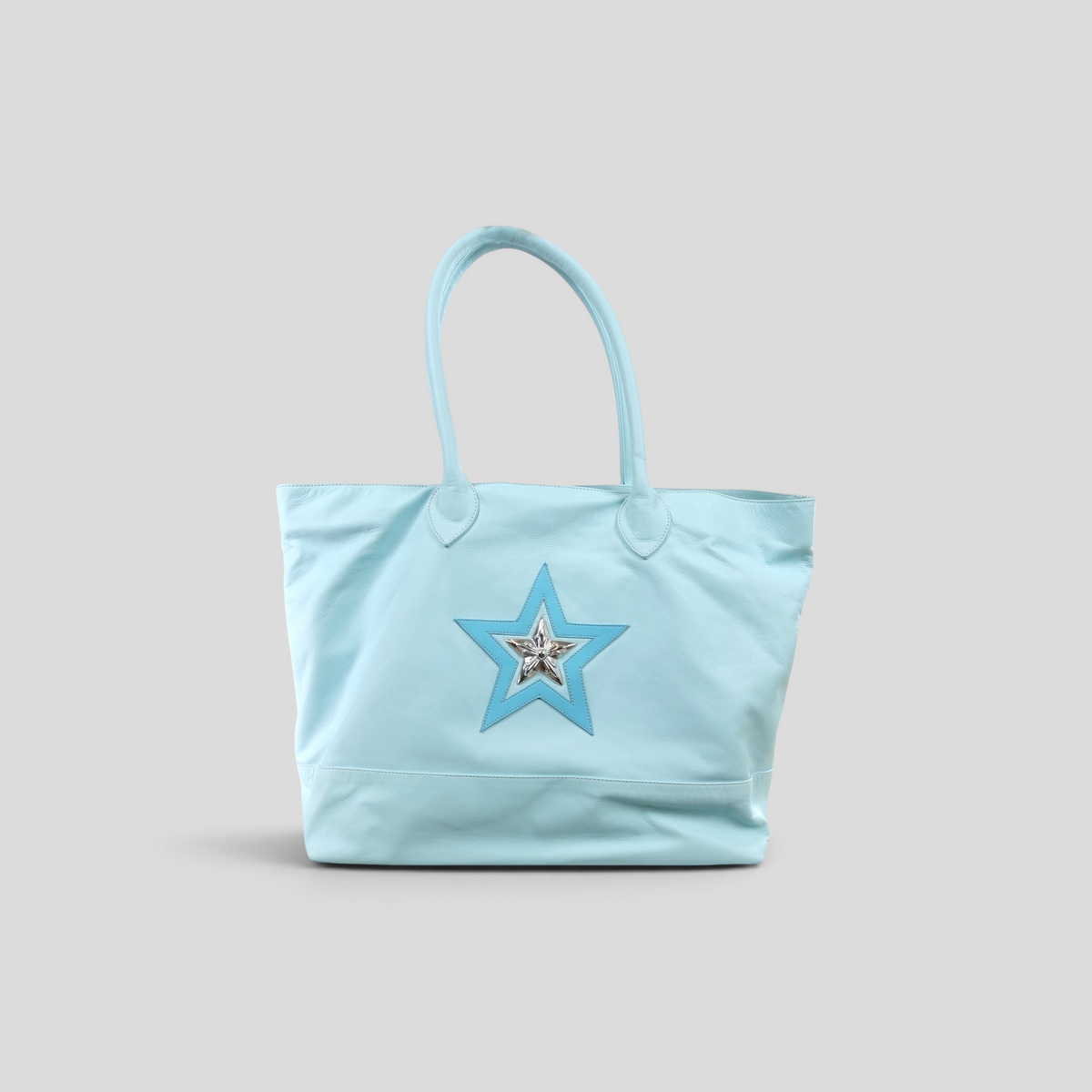CLB XXIII Chrome Hearts light blue leather tote bag featuring a decorative star patch with silver hardware detail.