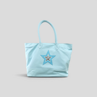 CLB XXIII Chrome Hearts light blue leather tote bag featuring a decorative star patch with silver hardware detail.