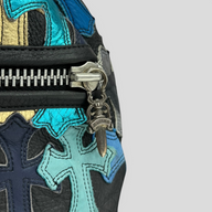 CLB XXIII pre-owned Chrome Hearts duffle bag featuring black leather with metallic blue and gold cross patches