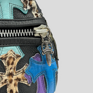 CLB XXIII Chrome Hearts XXL duffle bag featuring black leather, blue and purple cross patches, and leopard print accents