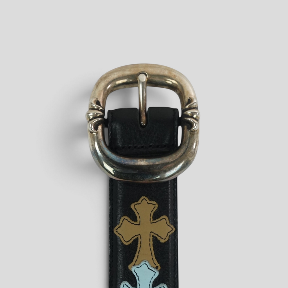 CLB XXIII Chrome Hearts black leather belt featuring a silver gunslinger buckle and multi-colored cross patches