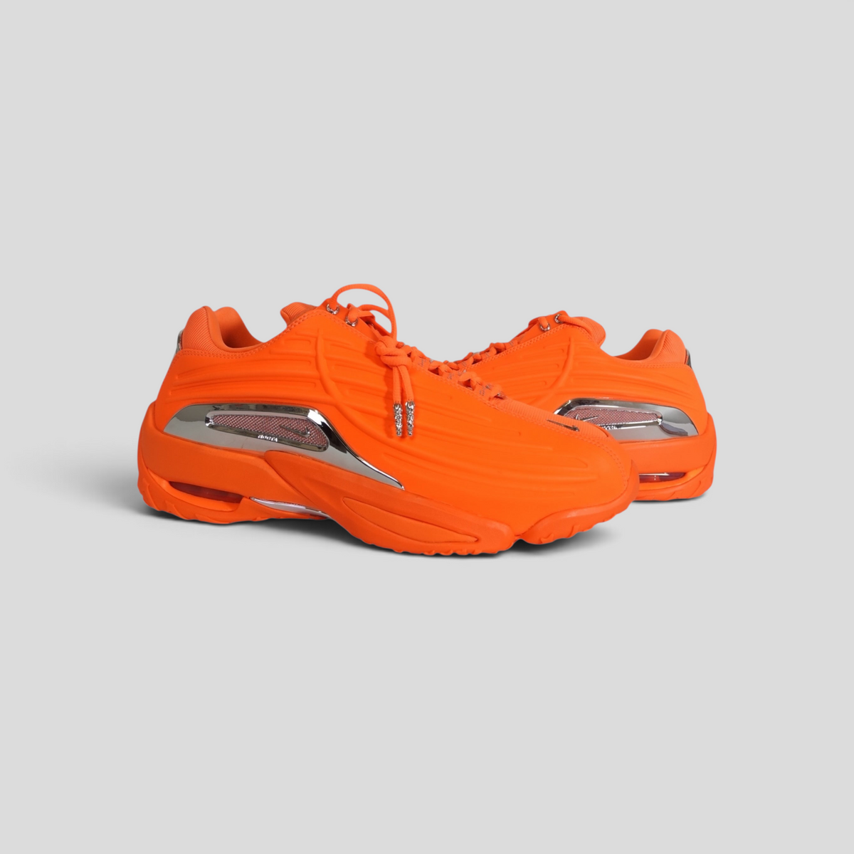 CLB XXIII Chrome Hearts x Nocta Nike Hot Step II sneakers in bright orange with metallic silver side accents