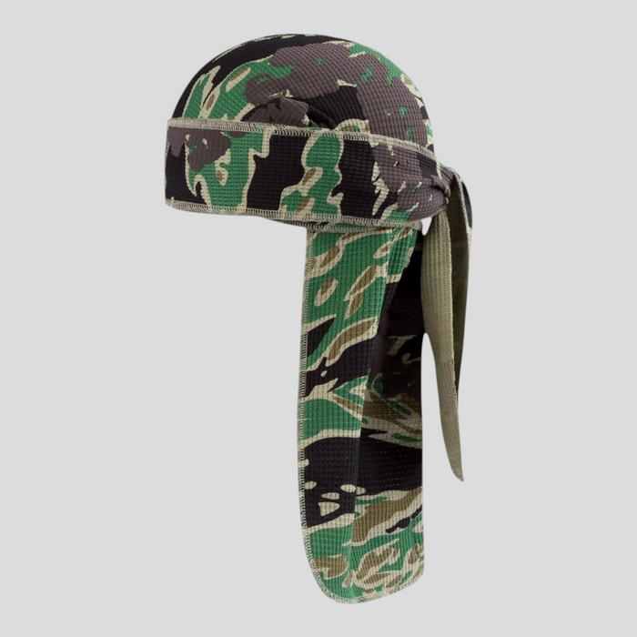 CLB XXIII Denim Tears green camo cotton wreath durag with textured fabric and long tie-back straps.