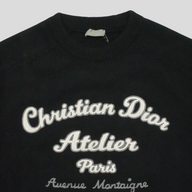 CLB XXIII black virgin wool sweater featuring white Christian Dior Atelier embroidery on the chest